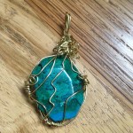 Chrysocolla and brass pendant